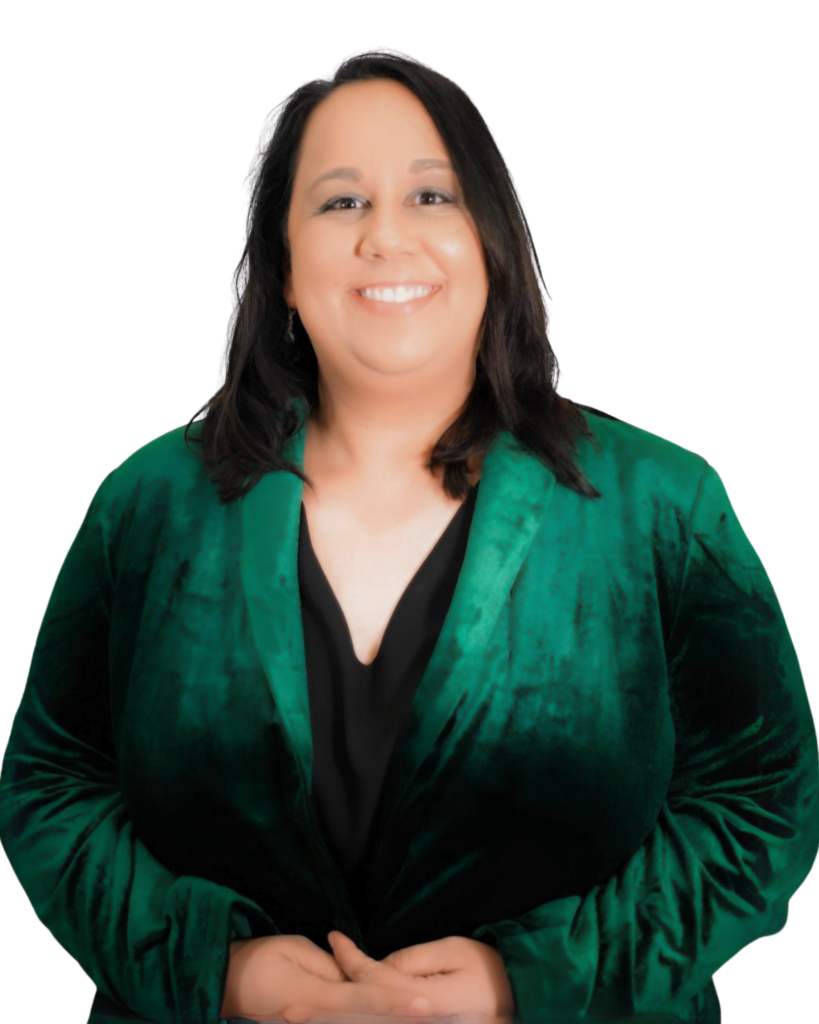 A professional headshot of a woman with dark hair, wearing a green velvet blazer over a black top. She is smiling and facing the camera against a plain white background.